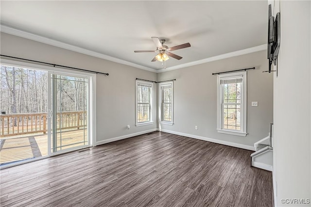 unfurnished room featuring crown molding, dark wood-style floors, baseboards, and ceiling fan