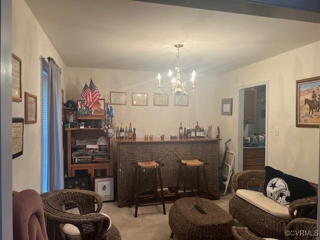 bar with a bar, carpet, and a notable chandelier