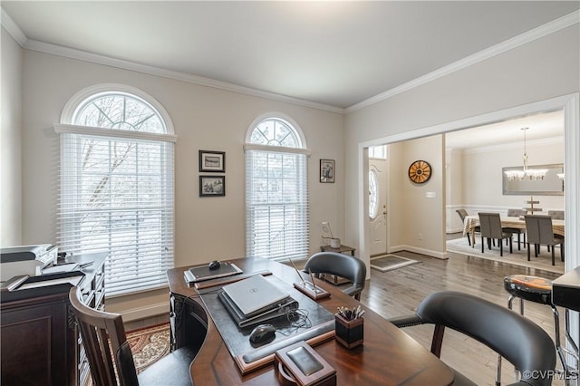 home office with a chandelier, crown molding, baseboards, and wood finished floors