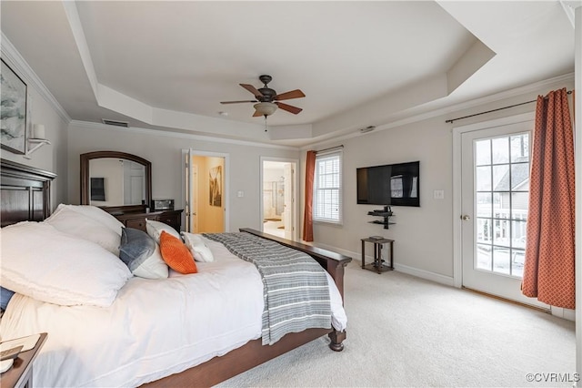 bedroom featuring light carpet, access to exterior, baseboards, and a raised ceiling