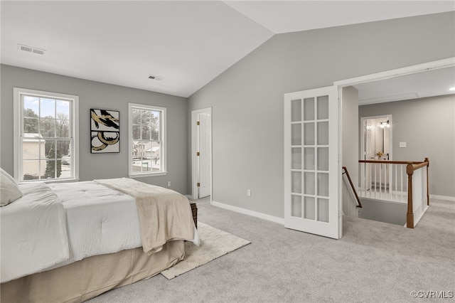 carpeted bedroom featuring vaulted ceiling