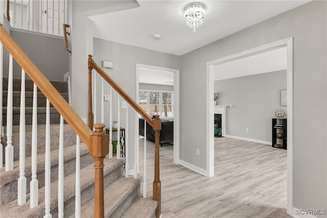 staircase featuring hardwood / wood-style floors