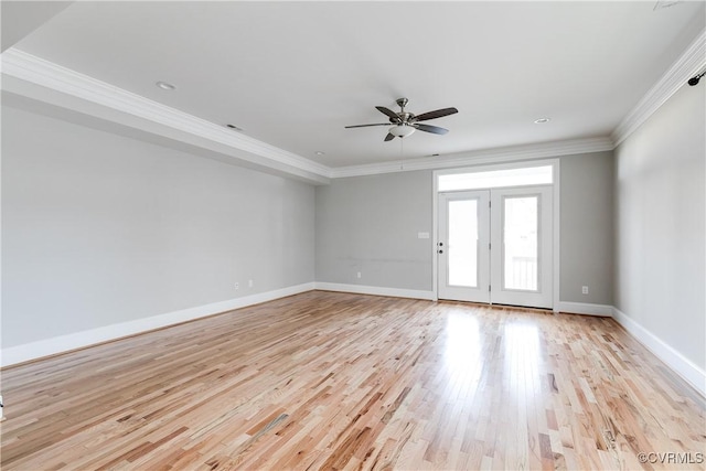 unfurnished room with a ceiling fan, light wood-style flooring, baseboards, and crown molding