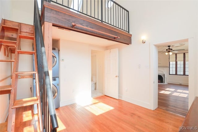 interior space with stacked washer / dryer and a balcony