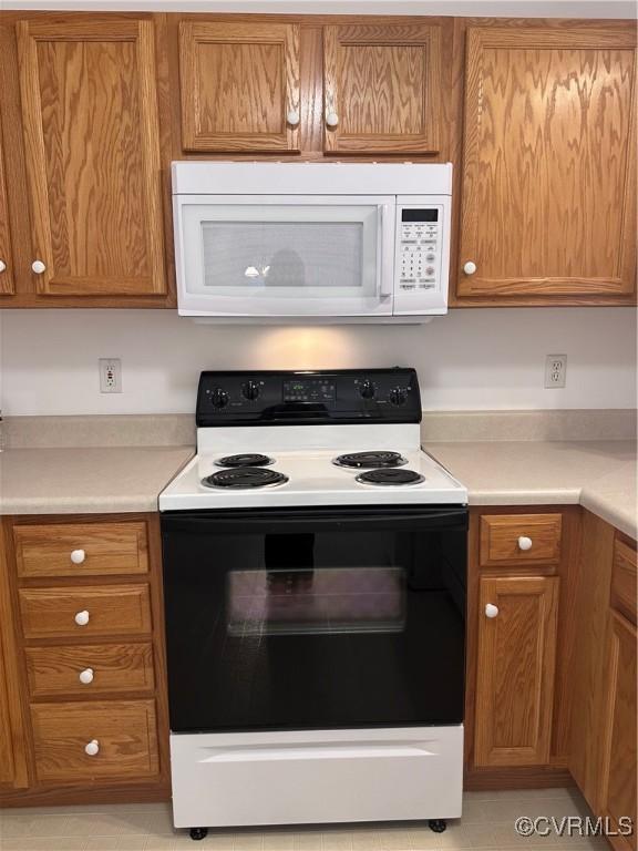 kitchen with range with electric cooktop