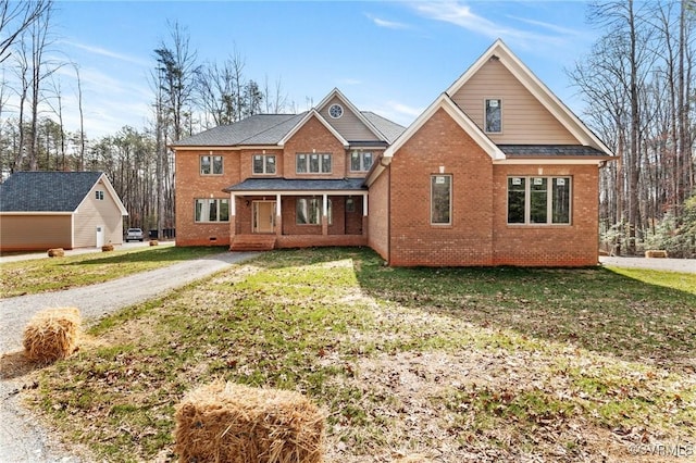 view of front of property featuring a front yard and brick siding