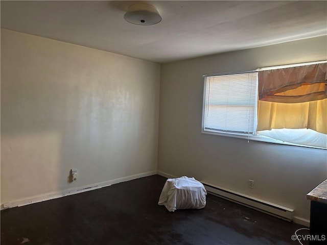 unfurnished room with a baseboard radiator