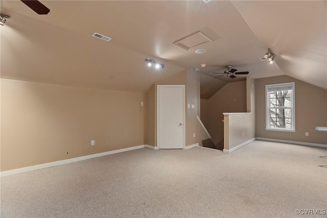 additional living space with light carpet and lofted ceiling