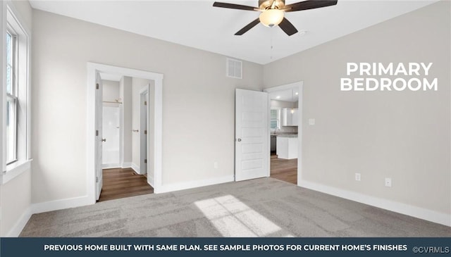 unfurnished bedroom featuring carpet floors, visible vents, ceiling fan, and baseboards