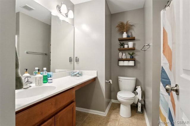 full bath featuring toilet, vanity, baseboards, visible vents, and tile patterned floors