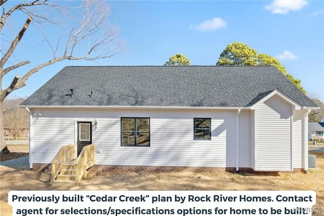 rear view of house featuring roof with shingles and cooling unit