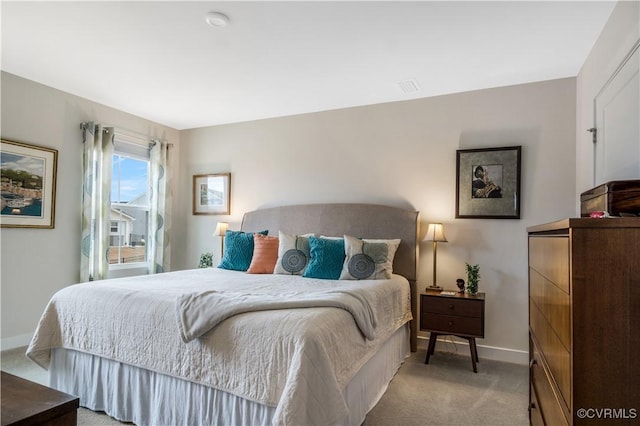 bedroom with baseboards, carpet flooring, and visible vents