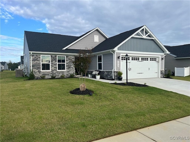 craftsman-style home with an attached garage, board and batten siding, stone siding, driveway, and a front lawn