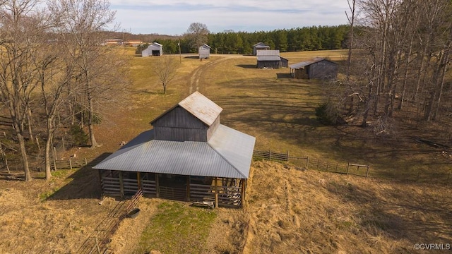 birds eye view of property with a rural view