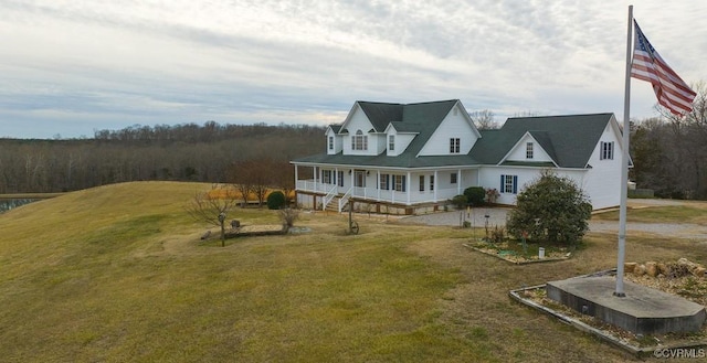 view of front of property featuring covered porch and a front lawn