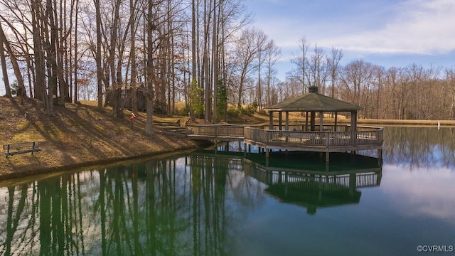 dock area with a gazebo and a water view