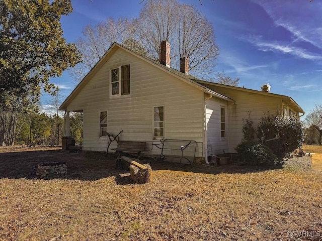 view of side of property with central air condition unit