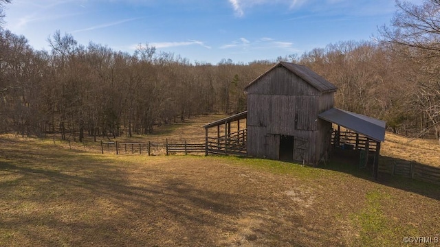 view of outdoor structure featuring a yard and a rural view