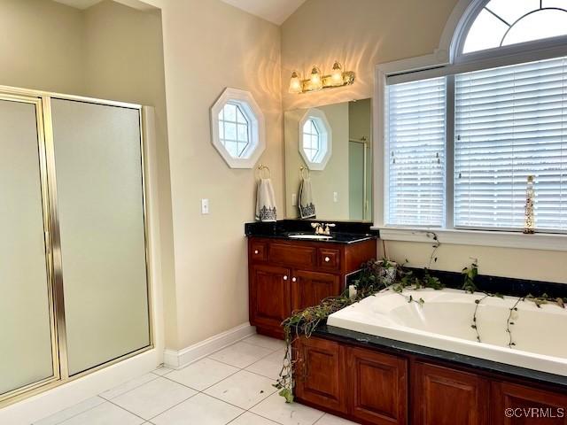 bathroom featuring vanity, tile patterned flooring, and a shower with door