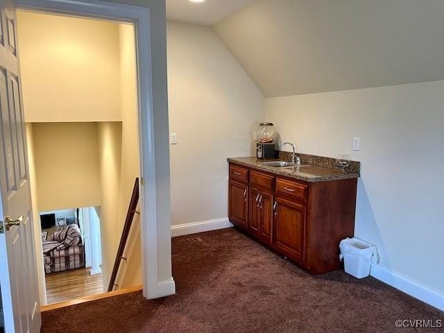 bathroom with vaulted ceiling and sink