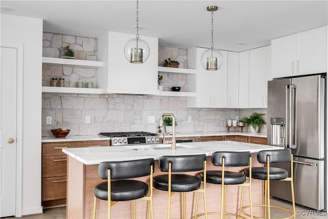 kitchen with open shelves, high quality fridge, light countertops, and decorative backsplash