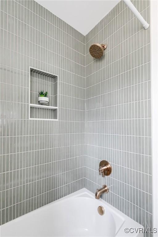 full bath featuring shower / bathtub combination