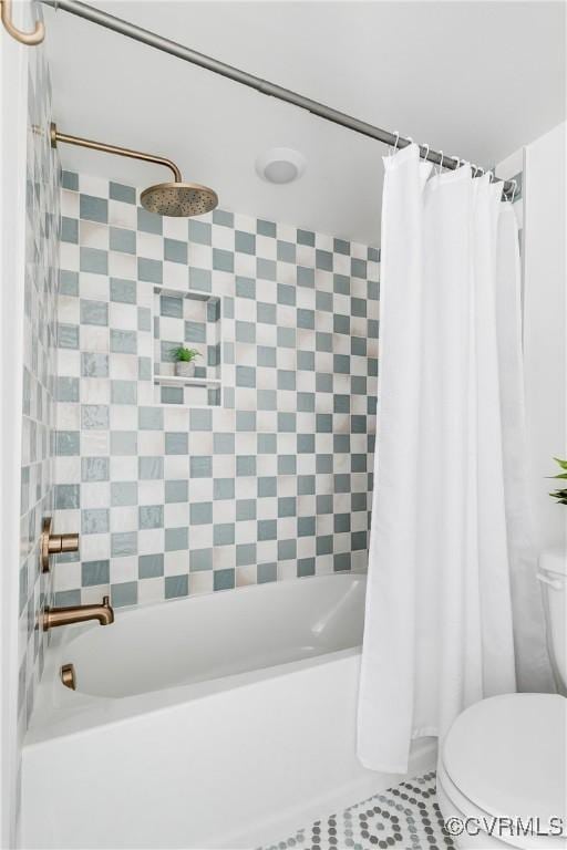 bathroom featuring toilet, shower / tub combo, and tile patterned flooring