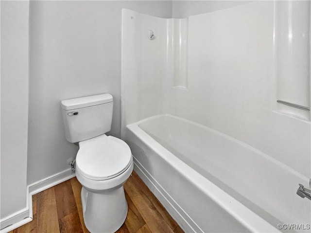 bathroom featuring hardwood / wood-style floors and toilet