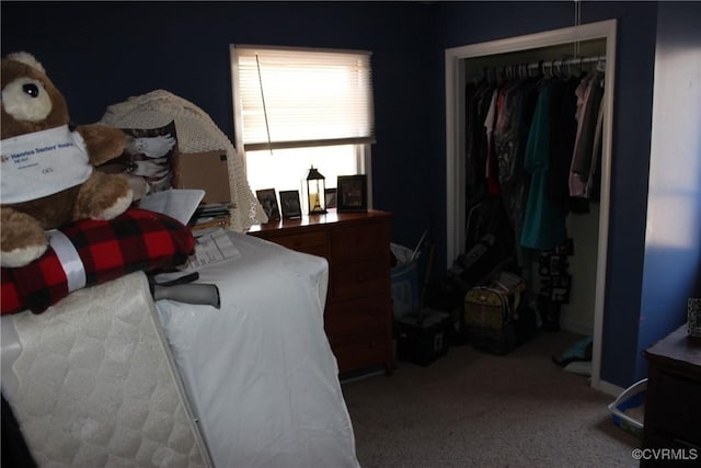 carpeted bedroom featuring a closet