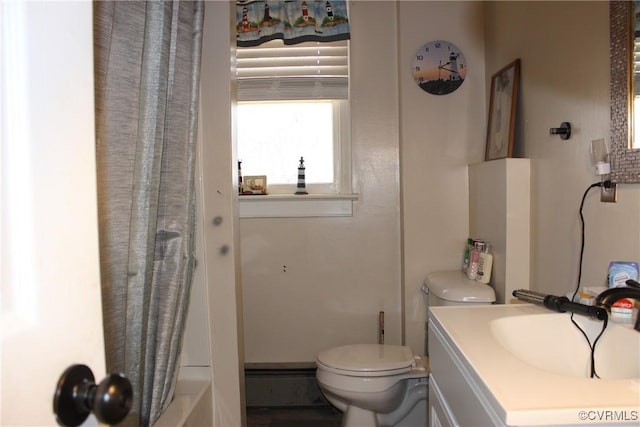 bathroom featuring vanity and toilet