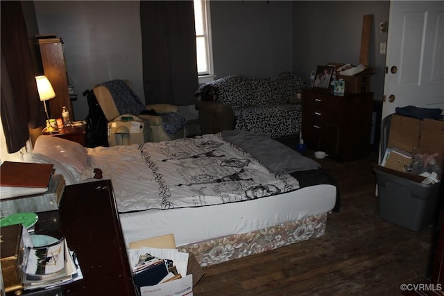 bedroom featuring wood finished floors