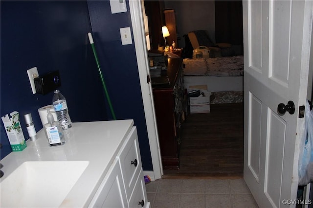 bathroom with a sink and tile patterned flooring