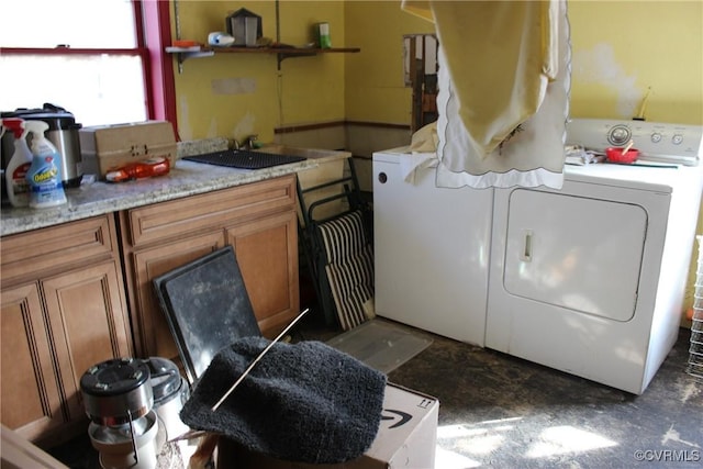 laundry room with washing machine and dryer and cabinet space