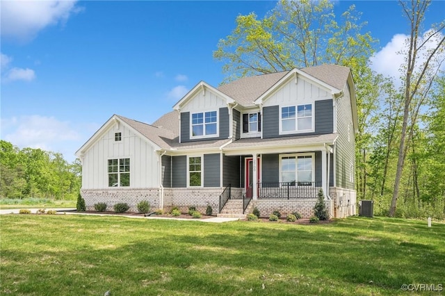 2700 Maidens Rd, Powhatan, VA 23139 - view of front of house featuring board and batten siding, central air condition unit, a front yard, and covered porch