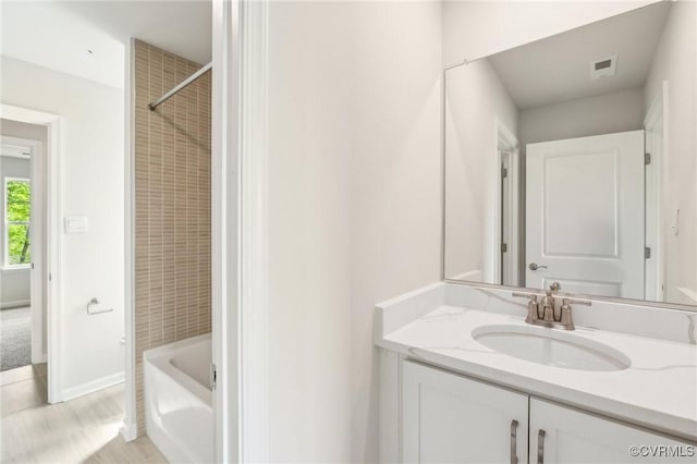2700 Maidens Rd, Powhatan, VA 23139 - full bathroom with visible vents, baseboards, vanity, and washtub / shower combination