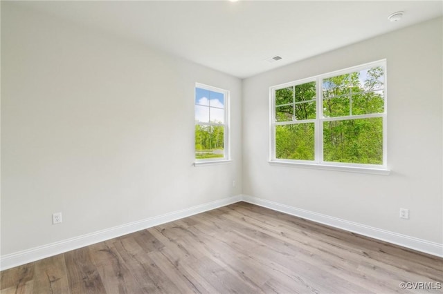 2700 Maidens Rd, Powhatan, VA 23139 - empty room featuring visible vents, plenty of natural light, wood finished floors, and baseboards