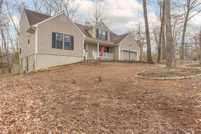 view of front of property featuring a garage and covered porch