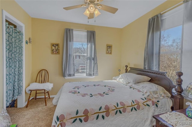 carpeted bedroom featuring ceiling fan