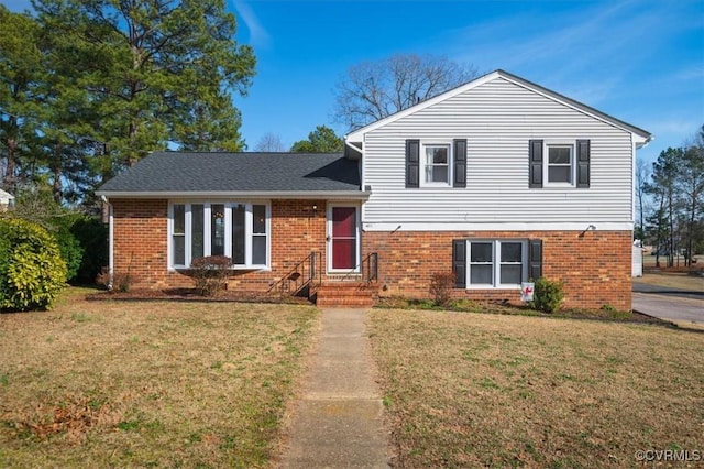 tri-level home with a front yard