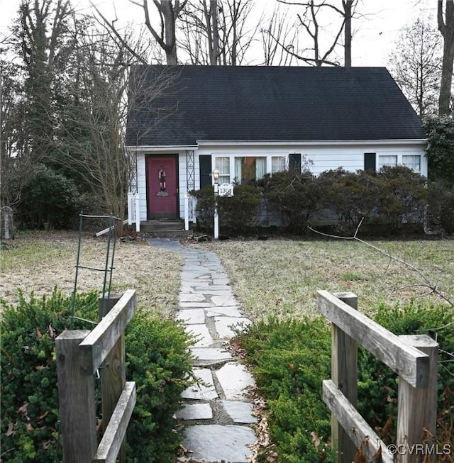 view of front facade featuring a shingled roof