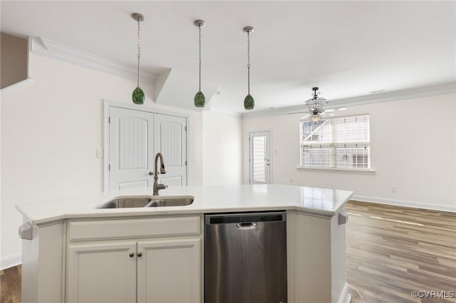 kitchen with sink, white cabinetry, dishwasher, crown molding, and a kitchen island with sink