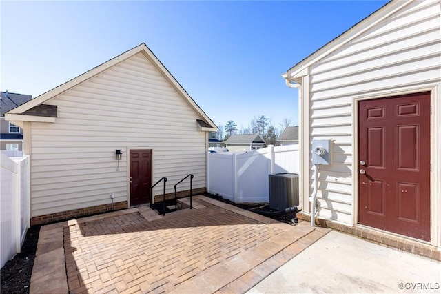 exterior space with a patio area and cooling unit