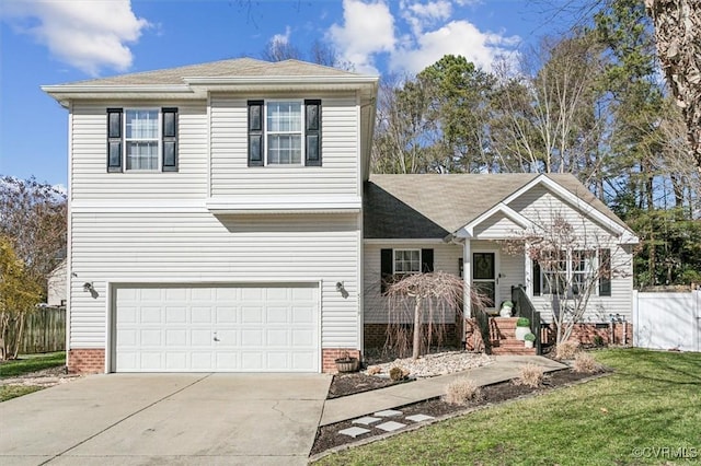 view of front of house with a front yard and a garage