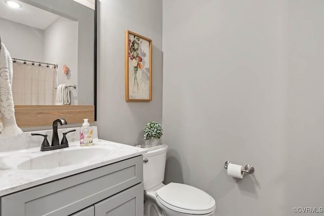 full bath with vanity and toilet