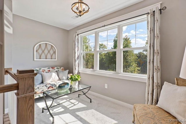 sitting room featuring a healthy amount of sunlight, carpet flooring, visible vents, and baseboards