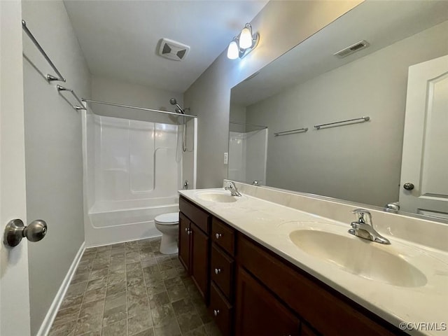 full bath featuring toilet, a sink, and visible vents