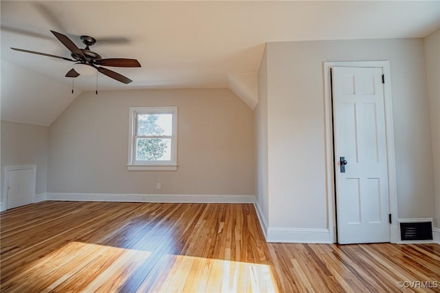 bonus room with ceiling fan, light wood-type flooring, and vaulted ceiling