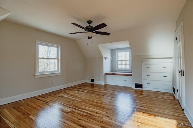 bonus room featuring ceiling fan, light hardwood / wood-style floors, and lofted ceiling