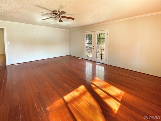 spare room with crown molding, french doors, a textured ceiling, and hardwood / wood-style floors