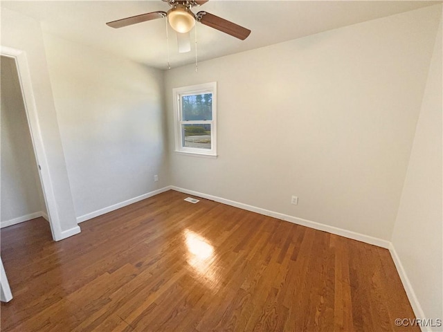 unfurnished bedroom featuring dark hardwood / wood-style flooring and ceiling fan